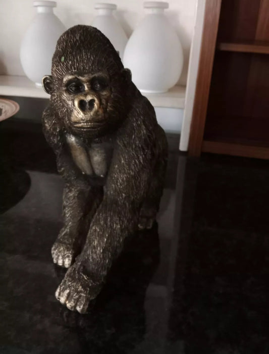 A DECORATIVE GORILLA SCULPTURE